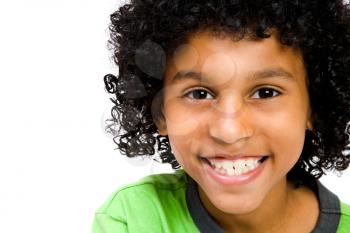 Boy wearing t-shirt and smiling isolated over white