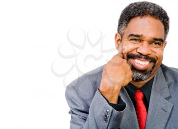 Businessman posing and smiling isolated over white