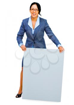 Confident businesswoman showing a placard and smiling isolated over white