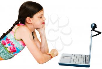 Close-up of a girl using a laptop and smiling isolated over white