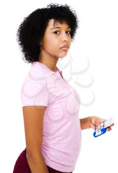 Close-up of a teenage girl text messaging on a mobile phone isolated over white