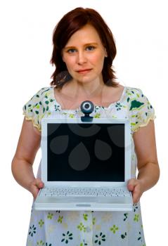 Mid adult woman showing a laptop and posing isolated over white