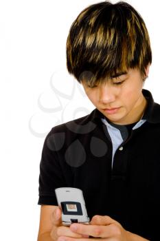 Close-up of a teenage boy text messaging on a mobile phone isolated over white