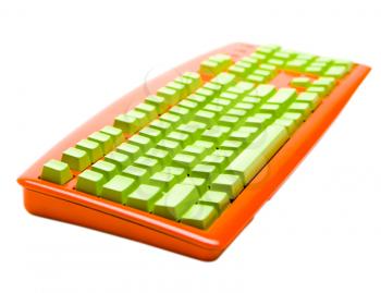 Green color keys of an orange keyboard isolated over white