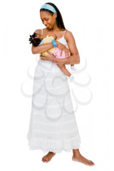 Mother carrying her daughter and smiling isolated over white