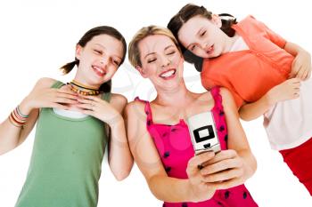 Lying woman photo messaging with her daughters isolated over white
