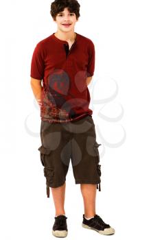 Confident boy posing and smiling isolated over white