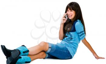 Teenager talking on a mobile phone and smiling isolated over white