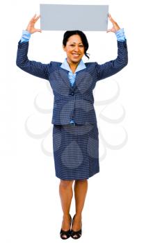 Mid adult businesswoman showing a placard and smiling isolated over white
