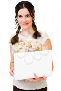 Young woman holding a laptop isolated over white
