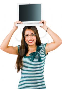 Smiling woman holding a laptop isolated over white