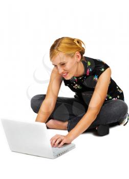 Young woman using a laptop and smiling isolated over white