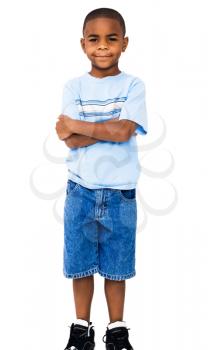 Portrait of a boy standing with his arms crossed isolated over white