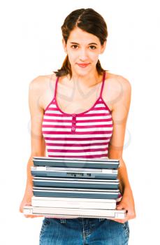 Happy woman holding a stack of laptops isolated over white