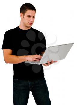 Latin American man using a laptop and posing isolated over white