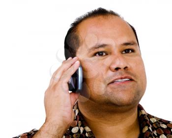 Man talking on a mobile phone and posing isolated over white
