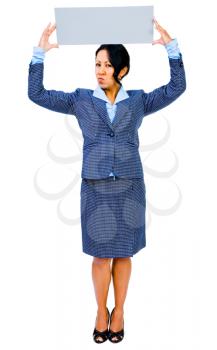 Businesswoman showing a placard and looking angry isolated over white