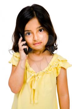 Child talking on a mobile phone isolated over white