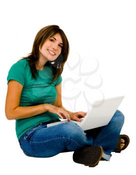 Gorgeous woman using a laptop and smiling isolated over white