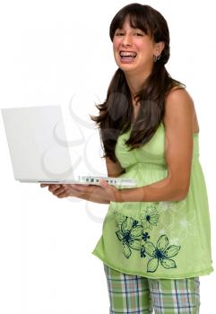 Asian teenage girl using a laptop and smiling isolated over white