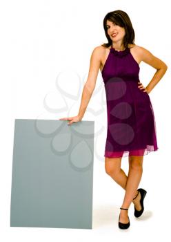 Beautiful woman showing an empty placard isolated over white