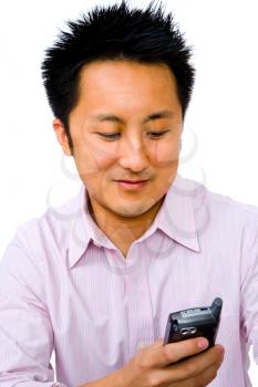 Smiling man text messaging on a mobile phone isolated over white