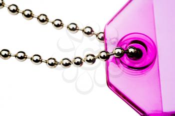 Pink color key chain isolated over white