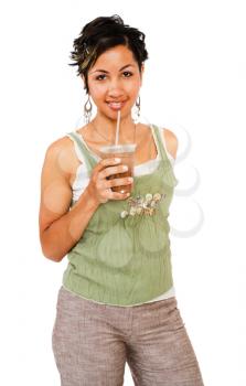 Young woman drinking chocolate shake and smiling isolated over white