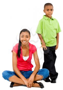 Boy smiling with a teenage girl isolated over white