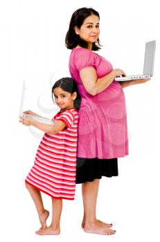 Portrait of a woman and her daughter using laptops isolated over white