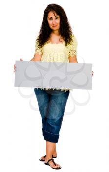 Fashion model showing a placard and smiling isolated over white