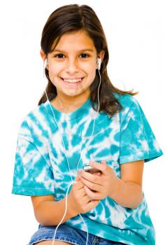 Smiling girl listening to music on a MP3 player isolated over white