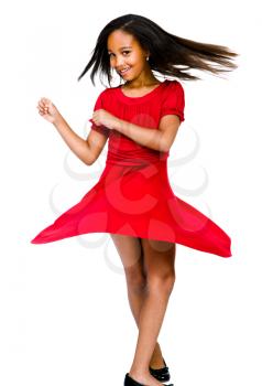 Portrait of a girl dancing and smiling isolated over white