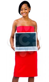 Asian woman showing a laptop and smiling isolated over white