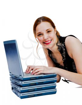 Caucasian woman using a laptop and smiling isolated over white