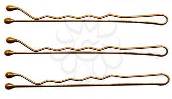 Metallic hairpins in a row isolated over white