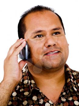 Mixedrace man talking on a mobile phone isolated over white