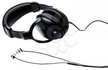Close-up of headphones and earbuds isolated over white