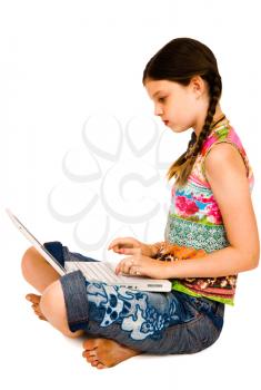 Caucasian girl using a laptop and posing isolated over white