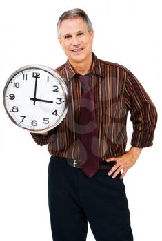 Happy businessman holding a clock isolated over white