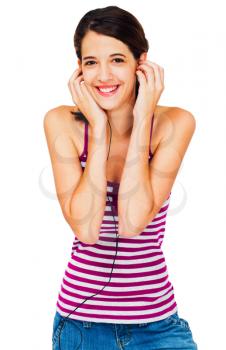 Beautiful woman listening to music on earbud isolated over white