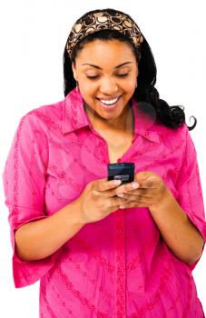 Woman text messaging on a mobile phone and smiling isolated over white