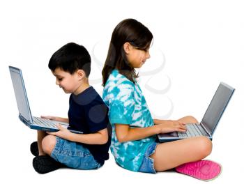Children using laptops together and posing isolated over white 