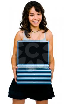 Latin American teenage girl holding a stack of laptops and smiling isolated over white