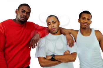 Close-up of three young men posing isolated over white