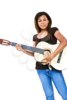 Child playing a guitar isolated over white