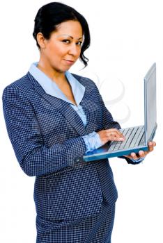 Close-up of a businesswoman using a laptop and smiling isolated over white