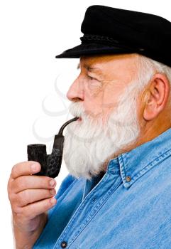 Caucasian man smoking with pipe isolated over white
