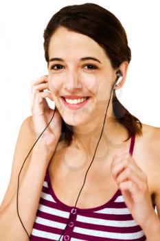 Caucasian woman listening to music on earbud isolated over white