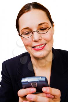 Smiling businesswoman text messaging on a mobile phone isolated over white